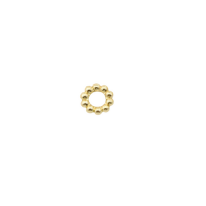 Gold beaded ring on a white background